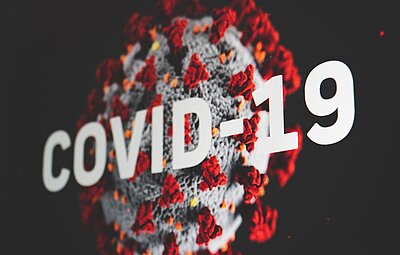 Virus mit Schriftzug COVID-19
